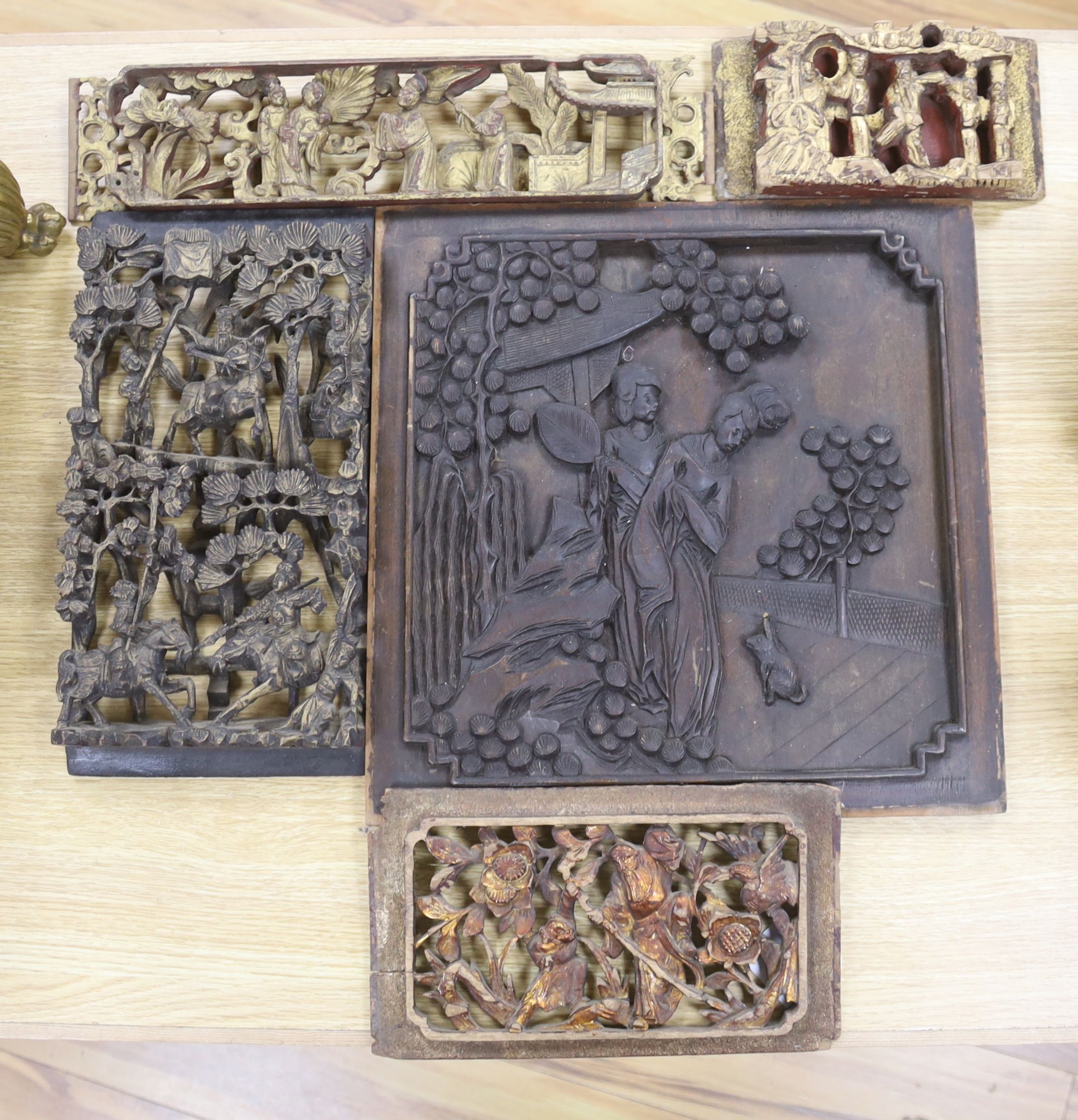 Three Chinese gilt wood carvings, largest 33.5cm and a wood panel 36.5cm